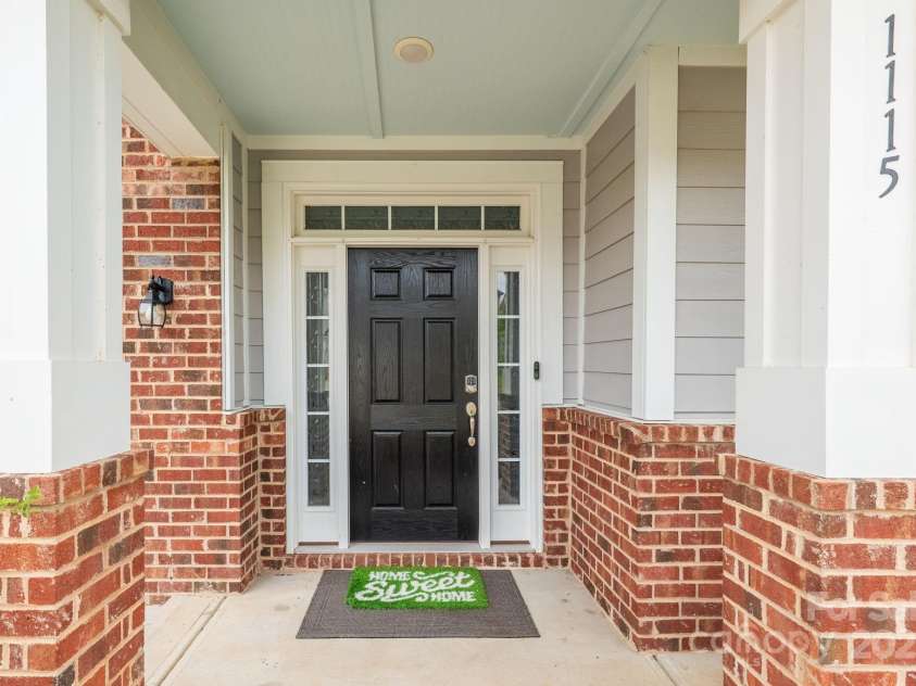 1115 Macallum Drive, Concord, NC 28027.  MLS# CAR4271321, YatesRealty ID 20626. Front Door Entrance with Covered Porch