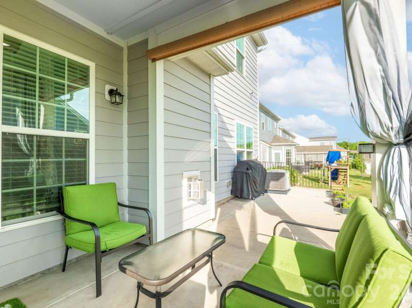 1115 Macallum Drive, Concord, NC 28027.  MLS# CAR4333035, YatesRealty ID 20626. Back porch