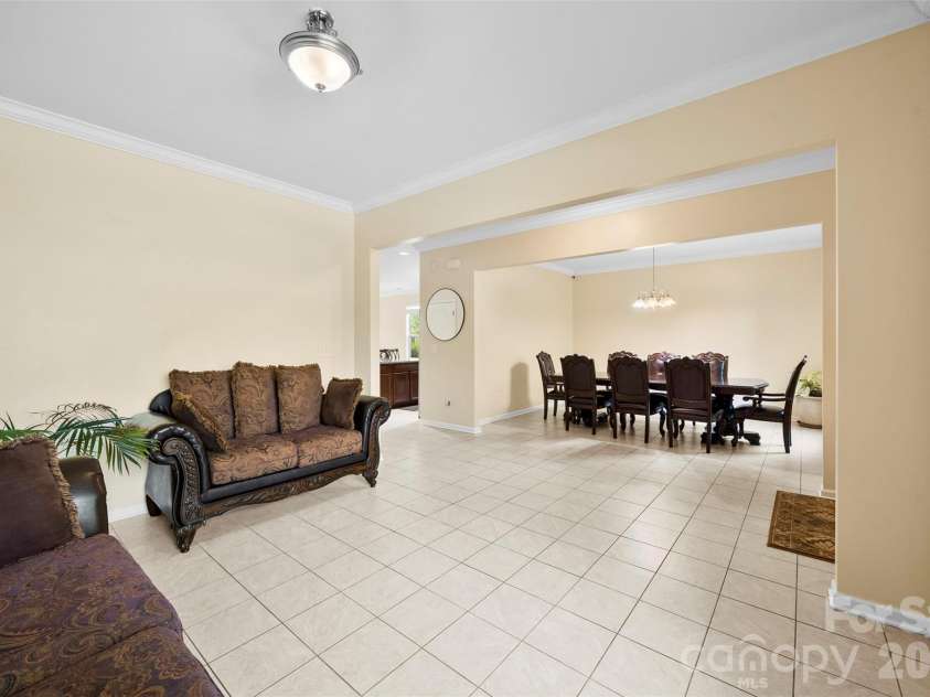700 Wood Lily Drive, Belmont, NC 28012.  MLS# CAR4379824, YatesRealty ID 20637. Formal Living Room and Dining room off foyer with current owner's furnishings.