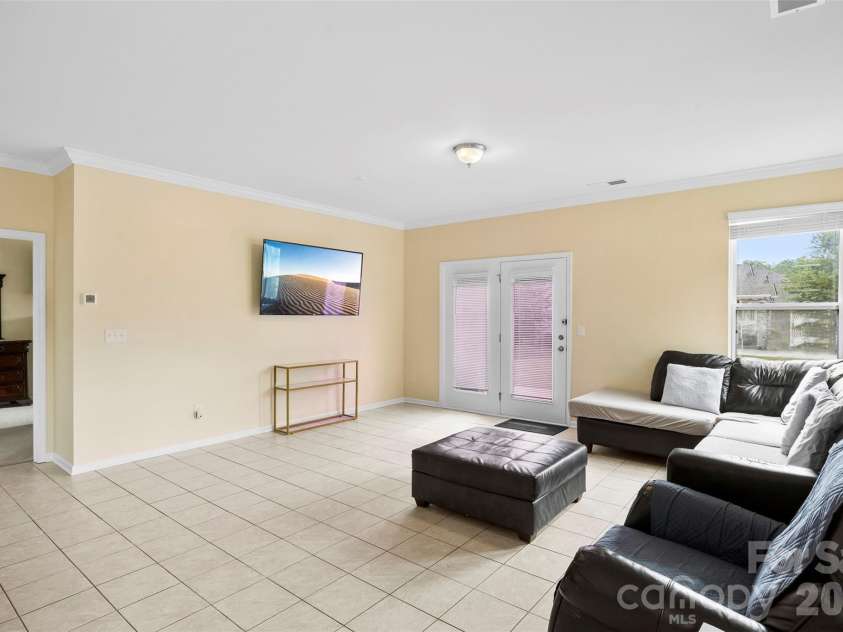 700 Wood Lily Drive, Belmont, NC 28012.  MLS# CAR4379824, YatesRealty ID 20637. Primary bedroom on main off family room - photo showing current owner's furnishings
