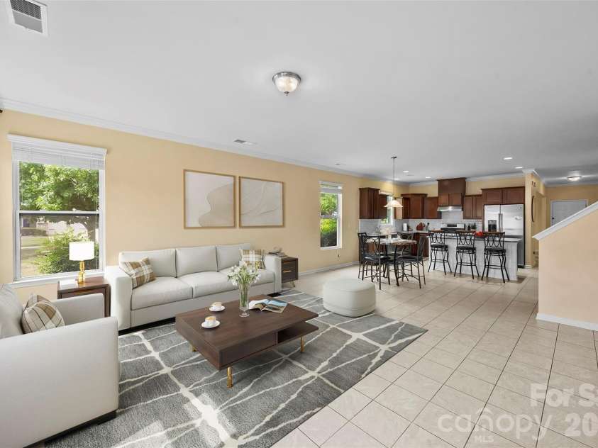 700 Wood Lily Drive, Belmont, NC 28012.  MLS# CAR4379824, YatesRealty ID 20637. Virtually Staged family room, nice and open into breakfast area and kitchen.