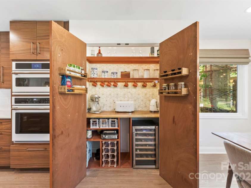 50 Honeysuckle Woods, Lake Wylie, SC 29710.  MLS# CAR4254838, YatesRealty ID 20638. Coffee/wine bar tucked away behind eclectic diner style doors