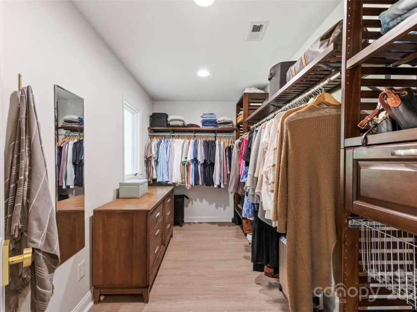 50 Honeysuckle Woods, Lake Wylie, SC 29710.  MLS# CAR4254838, YatesRealty ID 20638. Custom closet for the primary bedroom