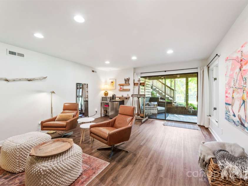 50 Honeysuckle Woods, Lake Wylie, SC 29710.  MLS# CAR4254838, YatesRealty ID 20638. Den in walk out basement opens to a lower level patio space