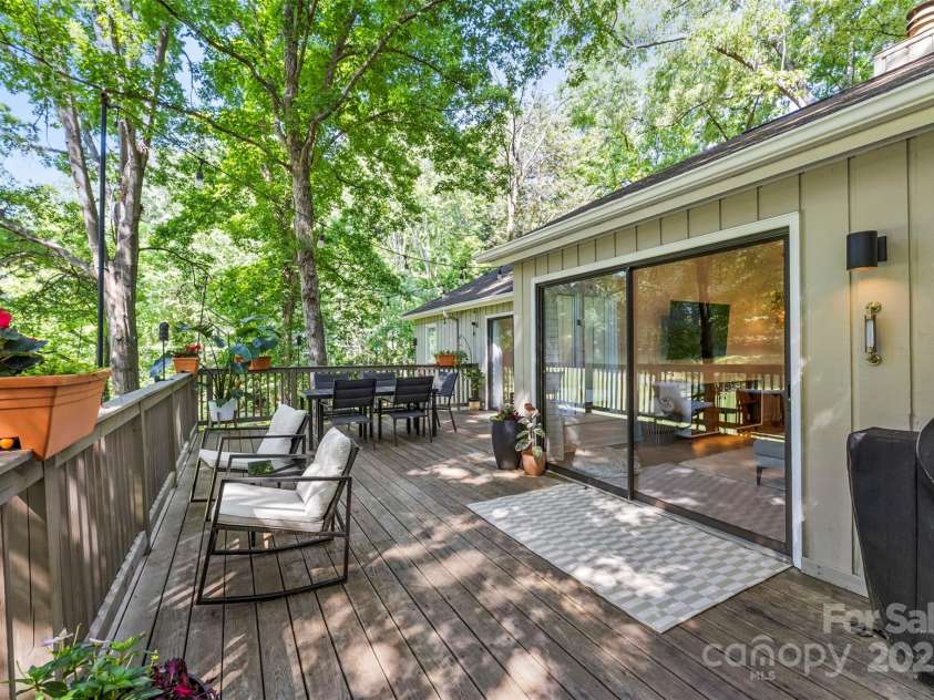 50 Honeysuckle Woods, Lake Wylie, SC 29710.  MLS# CAR4254838, YatesRealty ID 20638. Expansive deck space off the living room