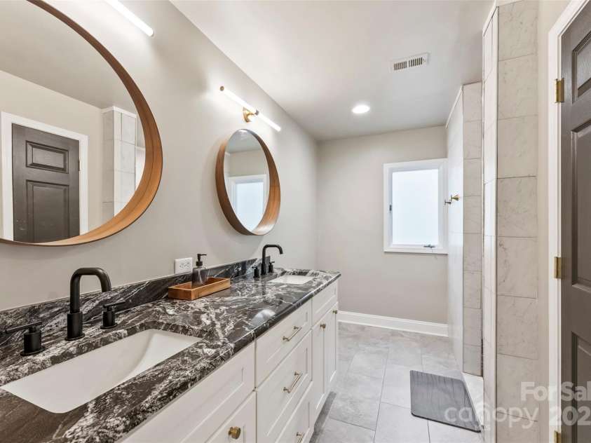 50 Honeysuckle Woods, Lake Wylie, SC 29710.  MLS# CAR4254838, YatesRealty ID 20638. Primary bath features dual vanity, tile floors, linen storage and walk in shower