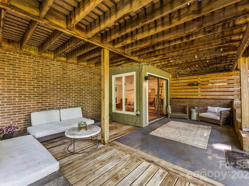 50 Honeysuckle Woods, Lake Wylie, SC 29710.  MLS# CAR4254838, YatesRealty ID 20638. Private patio space under the deck walks out to the golf course