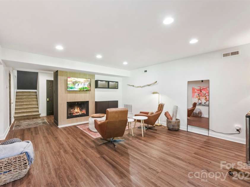 50 Honeysuckle Woods, Lake Wylie, SC 29710.  MLS# CAR4254838, YatesRealty ID 20638. Tile surround gas fireplace compliments the additional living space in the walk out basement