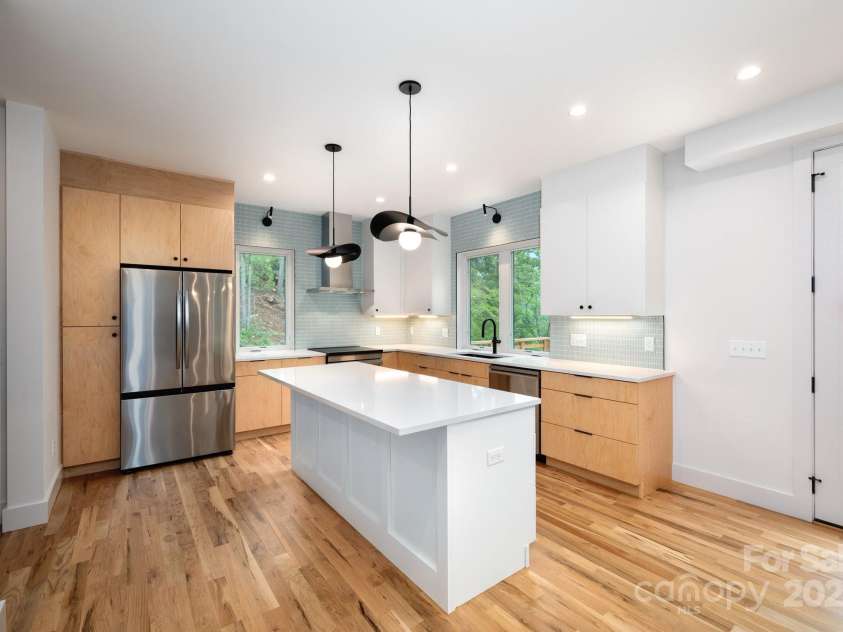 33 Windago Road, Weaverville, NC 28787.  MLS# CAR4268748, YatesRealty ID 20642. Contemporary Kitchen Features Quartz and Stainless Steel