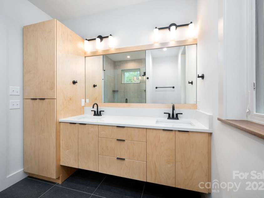 33 Windago Road, Weaverville, NC 28787.  MLS# CAR4268748, YatesRealty ID 20642. Floating Quartz-Topped Double Vanity