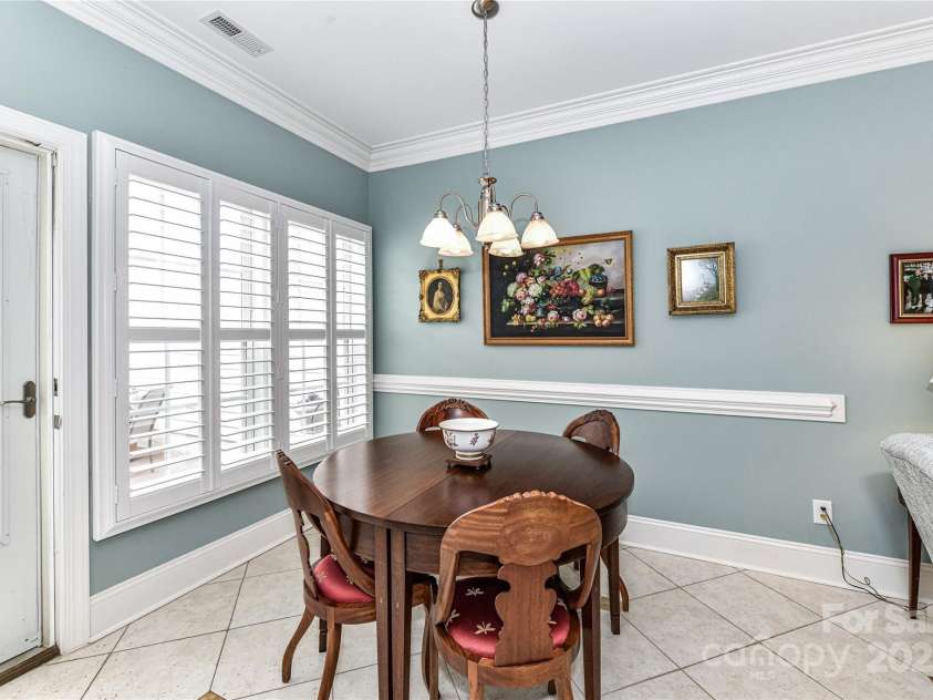 172 Harper Lee Street, Davidson, NC 28036.  MLS# CAR4249615, YatesRealty ID 20645. Breakfast area overlooking the private courtyard