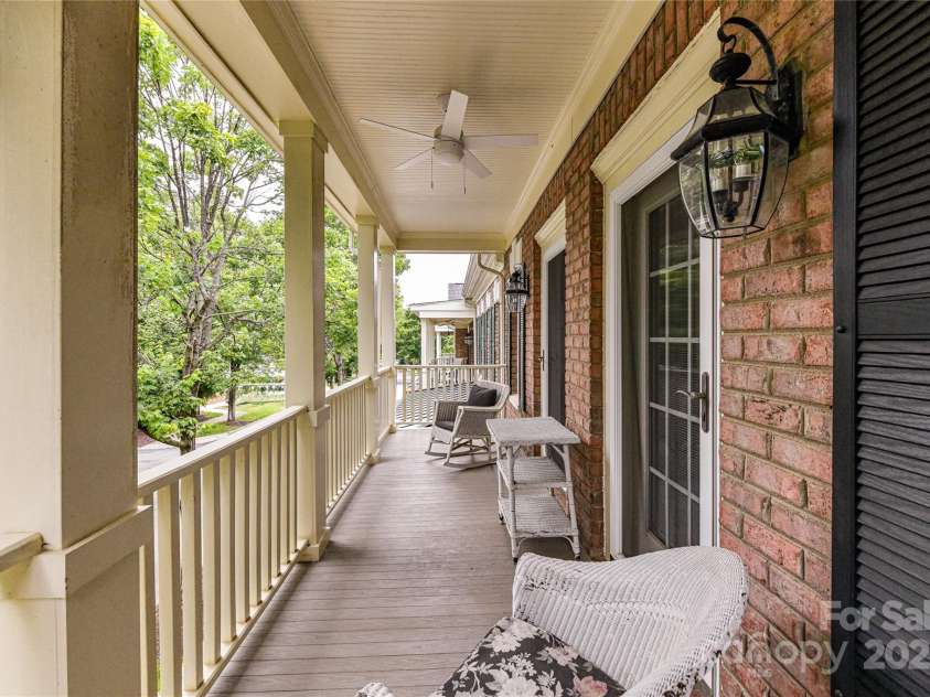 172 Harper Lee Street, Davidson, NC 28036.  MLS# CAR4249615, YatesRealty ID 20645. Covered porch on the second level over-looking the beautiful, tree-lined street