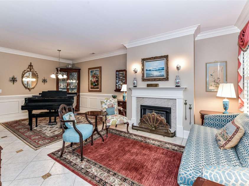 172 Harper Lee Street, Davidson, NC 28036.  MLS# CAR4249615, YatesRealty ID 20645. Formal Living Room and Dining Room with gas fireplace
