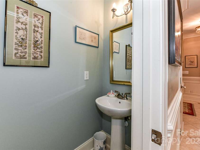 172 Harper Lee Street, Davidson, NC 28036.  MLS# CAR4249615, YatesRealty ID 20645. Half bath off the hallway on the main level