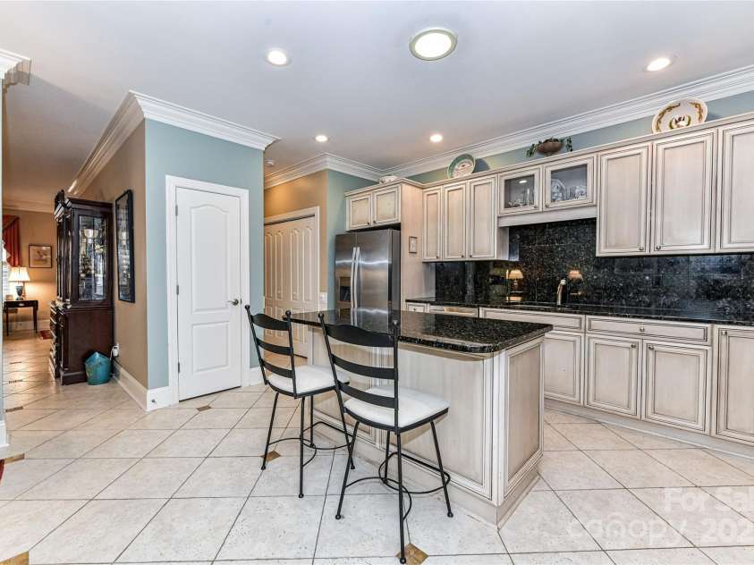 172 Harper Lee Street, Davidson, NC 28036.  MLS# CAR4249615, YatesRealty ID 20645. Kitchen has an island with extra seating and storage