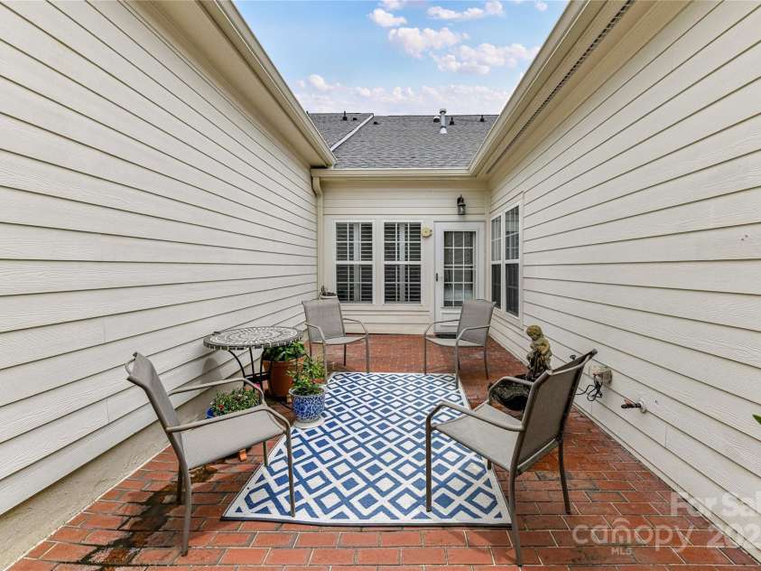 172 Harper Lee Street, Davidson, NC 28036.  MLS# CAR4249615, YatesRealty ID 20645. Private, brick courtyard patio
