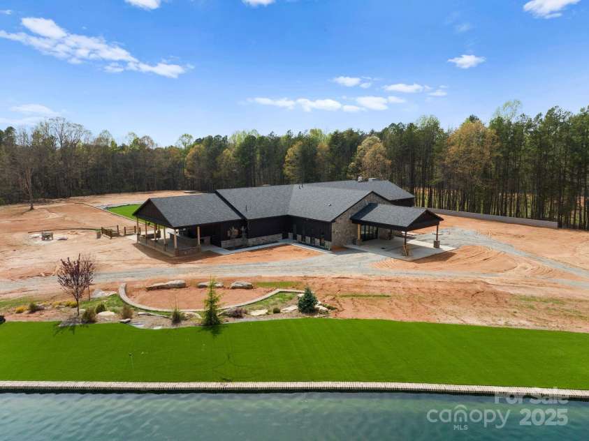 1565 Shinnville Road, Cleveland, NC 27013.  MLS# CAR4215250, YatesRealty ID 2066. Aerial of event venue and pond, with ample parking areas 