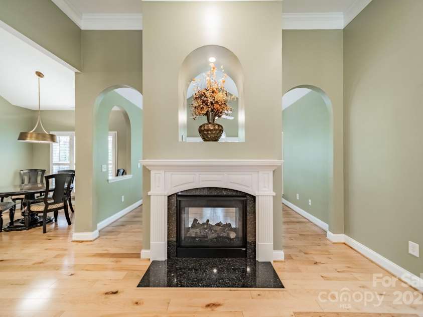12039 Lawings Corner Drive, Huntersville, NC 28078.  MLS# CAR4256636, YatesRealty ID 20665. Double Sided Fireplace into Sunroom