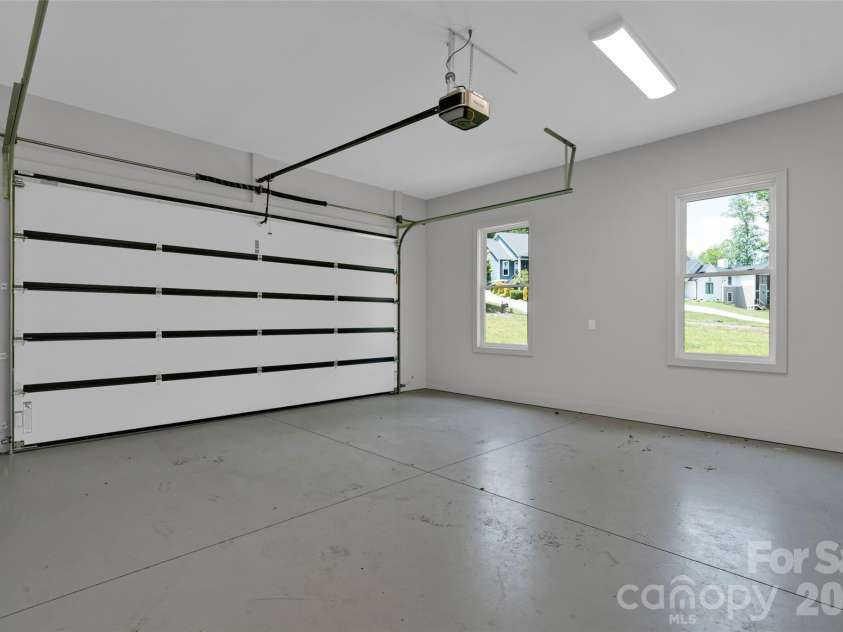 24 Copper Mill Court, Candler, NC 28715.  MLS# CAR4380494, YatesRealty ID 20665. Main level garage