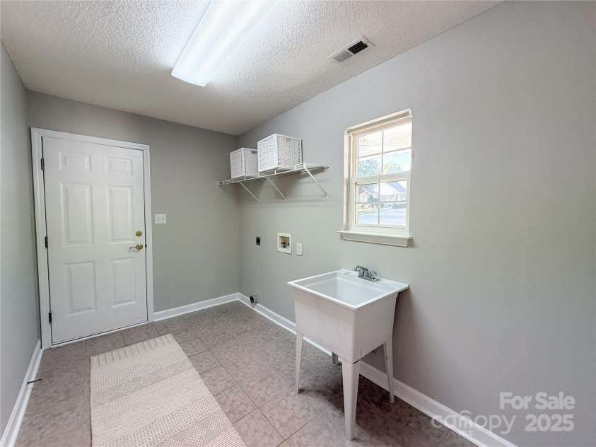 119 Ashwood Lane, Mooresville, NC 28117.  MLS# CAR4265345, YatesRealty ID 20670. Large laundry room