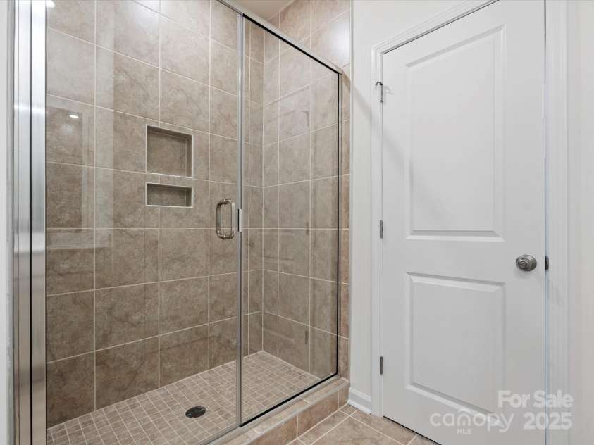 1074 Bull Dog Lane, Wingate, NC 28174.  MLS# CAR4264623, YatesRealty ID 20675. Representative Photo* Primary bath