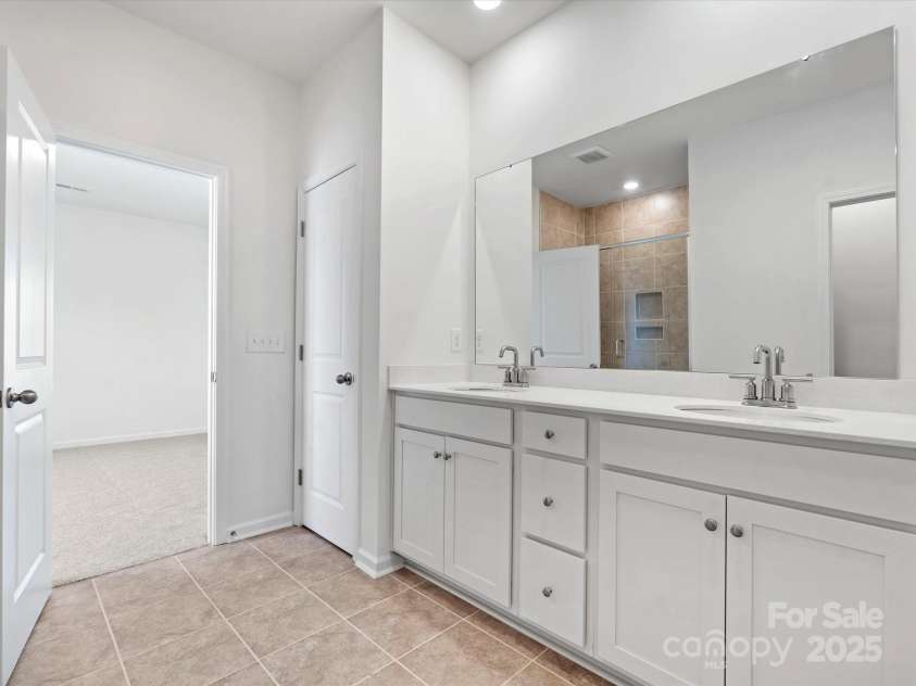 1074 Bull Dog Lane, Wingate, NC 28174.  MLS# CAR4264623, YatesRealty ID 20675. Representative Photo* Primary bath