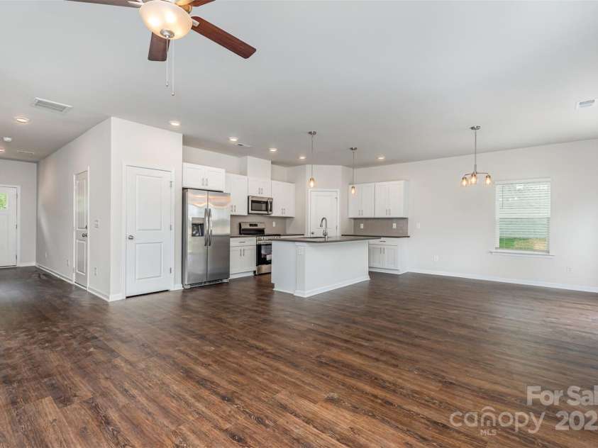 2059 Sadler Woods Lane, Charlotte, NC 28214.  MLS# CAR4265584, YatesRealty ID 20676. SPC flooring throughout 1st floor. Representational Photo.