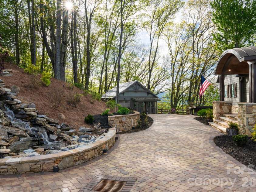376 Wandering Trail, Waynesville, NC 28785.  MLS# CAR4376234, YatesRealty ID 20678. Stunning private waterfall feature