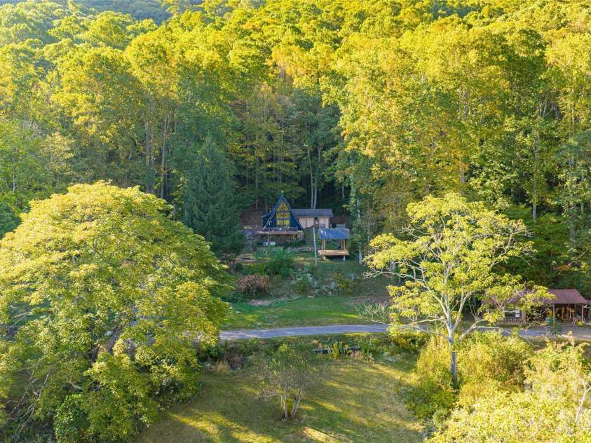 360 Banjo Branch Road, Burnsville, NC 28714.  MLS# CAR4379791, YatesRealty ID 20680. Borders National Forest with gardens, rolling fields, and multiple homesites—a serene and versatile mountain property. 