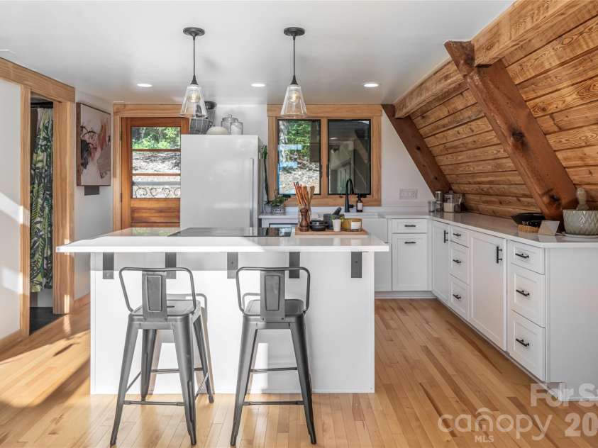 360 Banjo Branch Road, Burnsville, NC 28714.  MLS# CAR4379791, YatesRealty ID 20680. The home features a modern updated kitchen. 