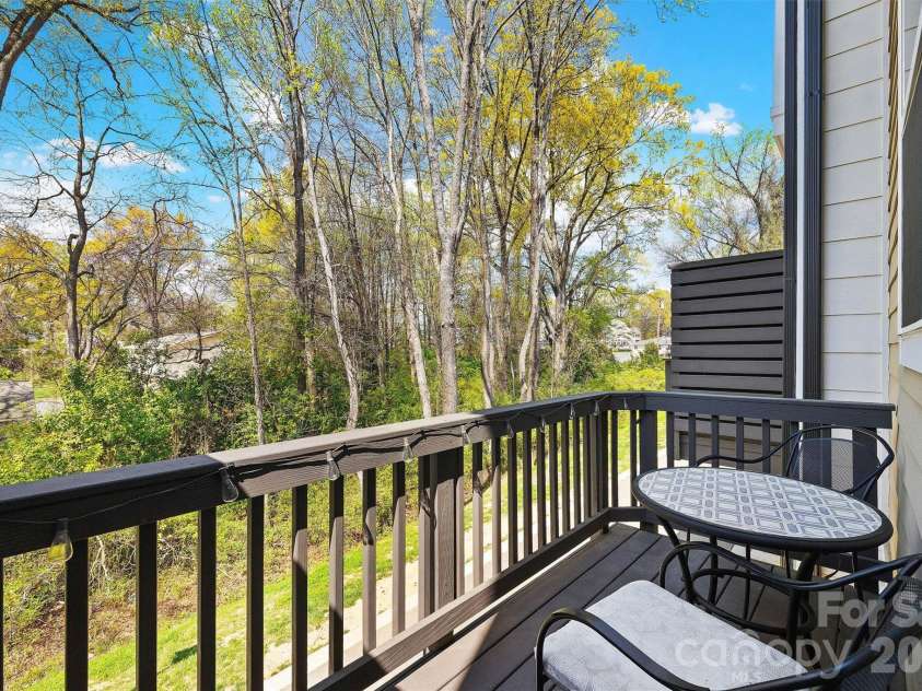 3225 Zenith Lane, Charlotte, NC 28205.  MLS# CAR4361849, YatesRealty ID 20683. Balcony backing to trees