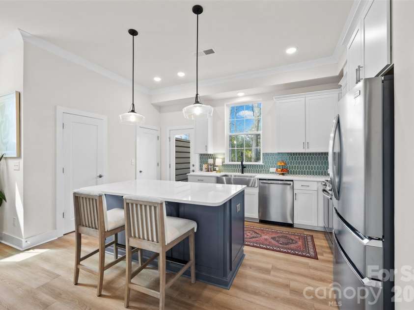 3225 Zenith Lane, Charlotte, NC 28205.  MLS# CAR4361849, YatesRealty ID 20683. Island kitchen with balcony