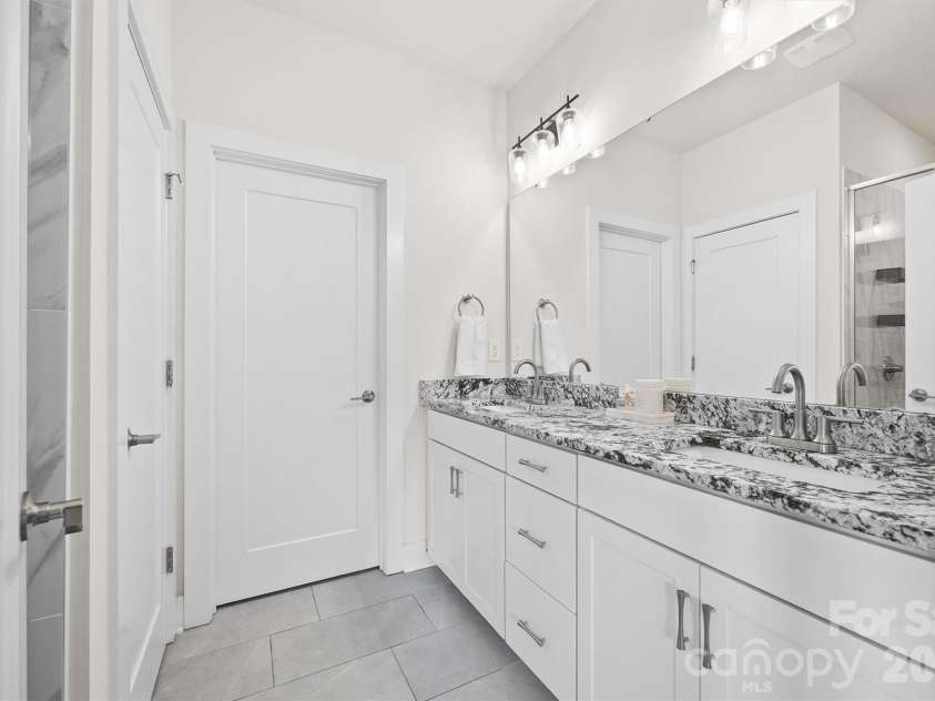 3225 Zenith Lane, Charlotte, NC 28205.  MLS# CAR4361849, YatesRealty ID 20683. Primary bathroom with dual sinks