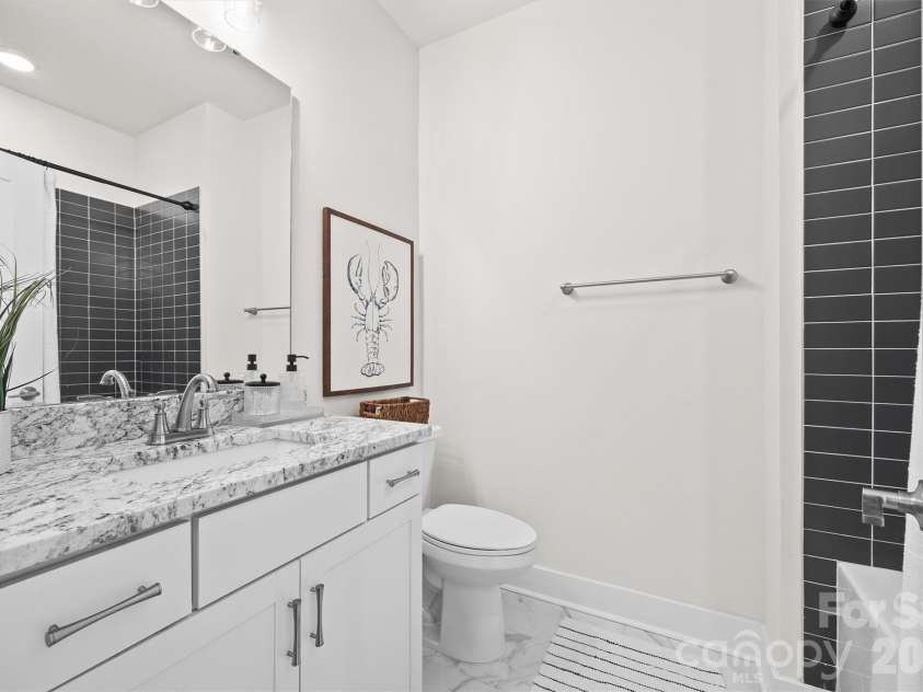 3225 Zenith Lane, Charlotte, NC 28205.  MLS# CAR4361849, YatesRealty ID 20683. Upper level full guest bathroom