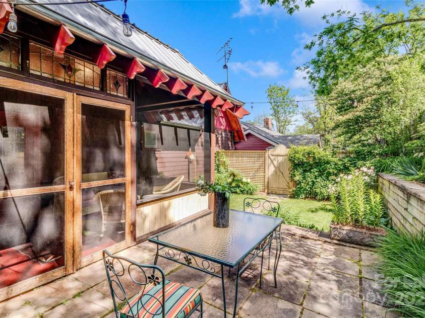 62 Elizabeth Place, Asheville, NC 28801.  MLS# CAR4254605, YatesRealty ID 20685. Delightful private garden/patio off the screened porch!