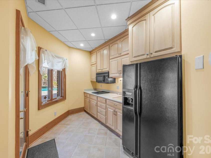 1043 Rolling Green Drive, Newton, NC 28658.  MLS# CAR4355758, YatesRealty ID 20693. Basement Kitchen