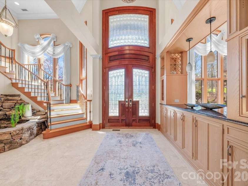1043 Rolling Green Drive, Newton, NC 28658.  MLS# CAR4355758, YatesRealty ID 20693. Foyer | Staircase | Water Feature