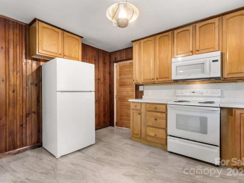 1725 Fallston Road, Shelby, NC 28150.  MLS# CAR4254792, YatesRealty ID 20698. There is a swinging door off the kitchen that leads to a half bath and the laundry room.