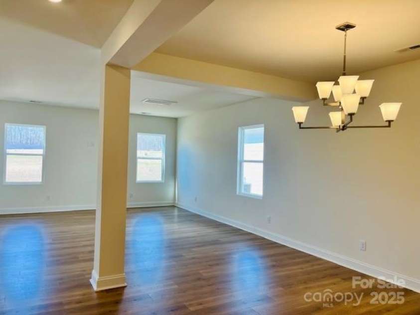 5041 Puddle Pond Road, Indian Trail, NC 28079.  MLS# CAR4302754, YatesRealty ID 207. Dining room/Great roomPhoto is for representational purposes only