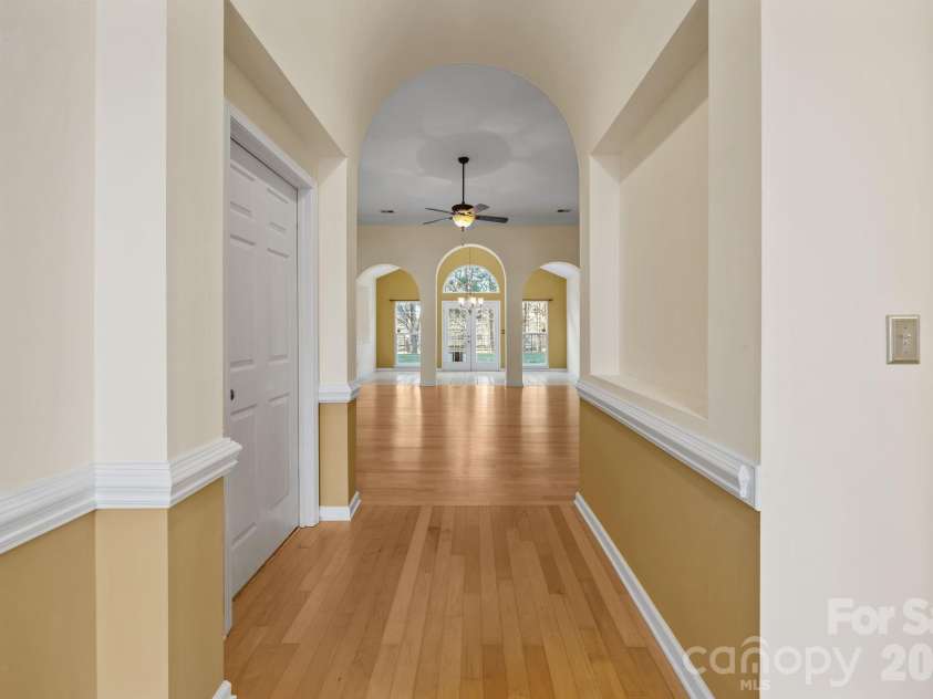 12602 Kemerton Lane, Huntersville, NC 28078.  MLS# CAR4356592, YatesRealty ID 20706. Front Hallway with View of the Sunroom and Backyard