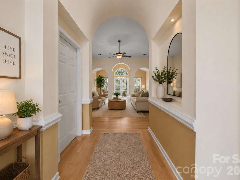 12602 Kemerton Lane, Huntersville, NC 28078.  MLS# CAR4356592, YatesRealty ID 20706. View from Entryway into the Main Living Area and Sunroom - Virtually Staged