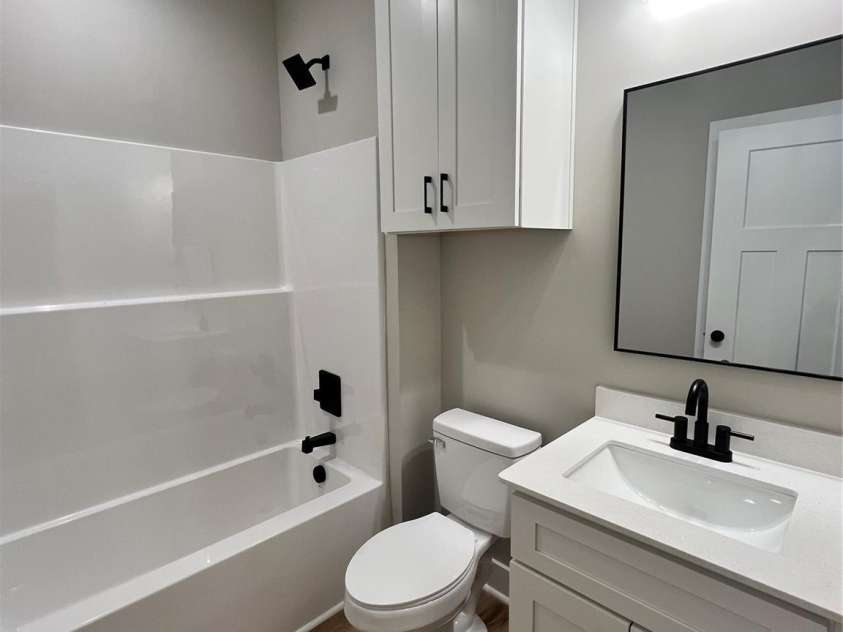 310 Coble Avenue, Albemarle, NC 28001.  MLS# CAR4379673, YatesRealty ID 20709. Hall Bathroom
