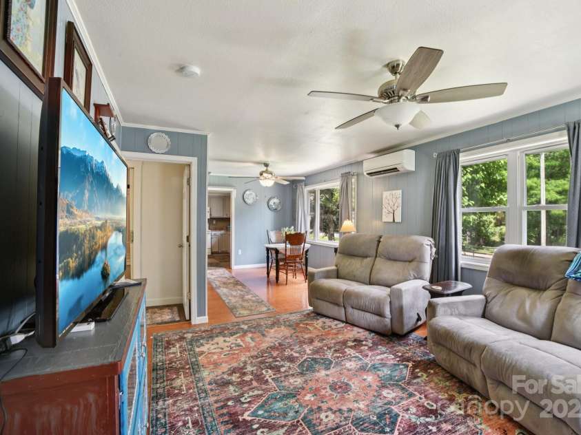 19 Lockman Road, Maggie Valley, NC 28751.  MLS# CAR4270927, YatesRealty ID 20711. Side view of living room