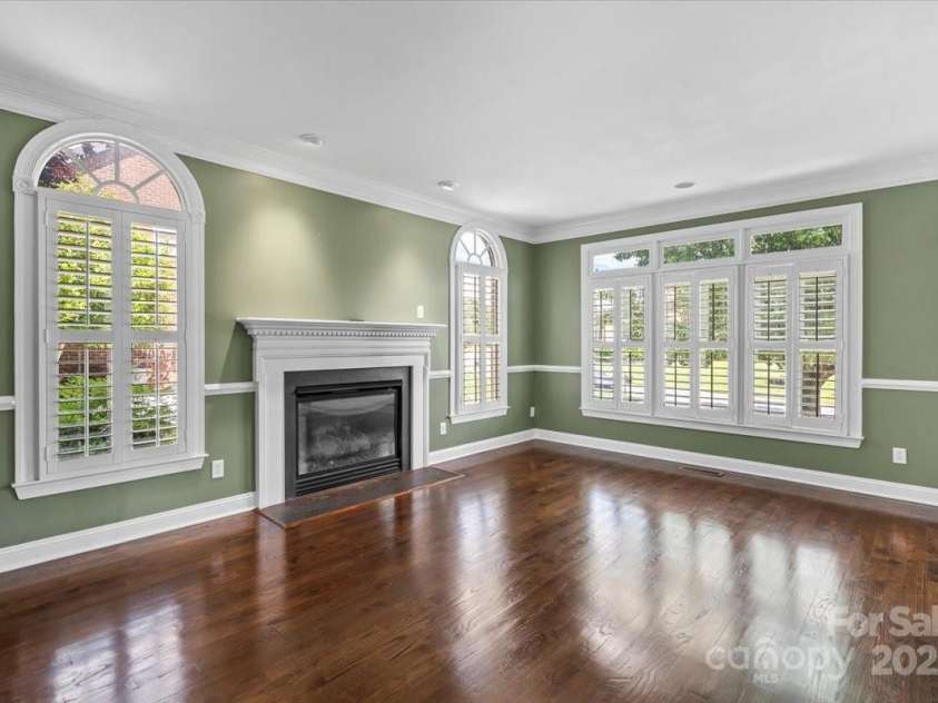 11917 Chevis Court, Charlotte, NC 28277.  MLS# CAR4250951, YatesRealty ID 20716. Formal Living Room w/ Fireplace & Natural Wood Floors