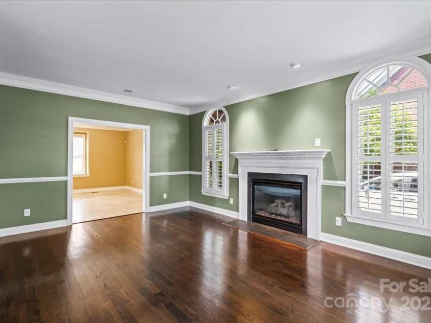 11917 Chevis Court, Charlotte, NC 28277.  MLS# CAR4250951, YatesRealty ID 20716. Formal Living Room w/ Fireplace & Natural Wood Floors