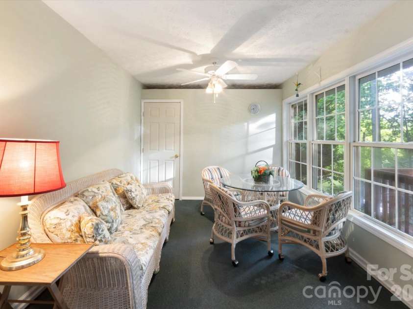 108 Bridgette Loop Road, Hendersonville, NC 28791.  MLS# CAR4378689, YatesRealty ID 20719. Three Season Room Overlooking the Back Deck and Workshop