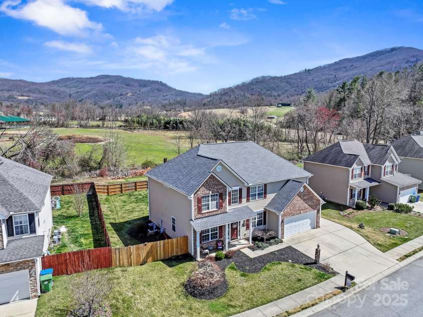 243 Wildbriar Road, Fletcher, NC 28732.  MLS# CAR4240300, YatesRealty ID 20721. Aerial view to showcase those stunning mountain and pastoral views
