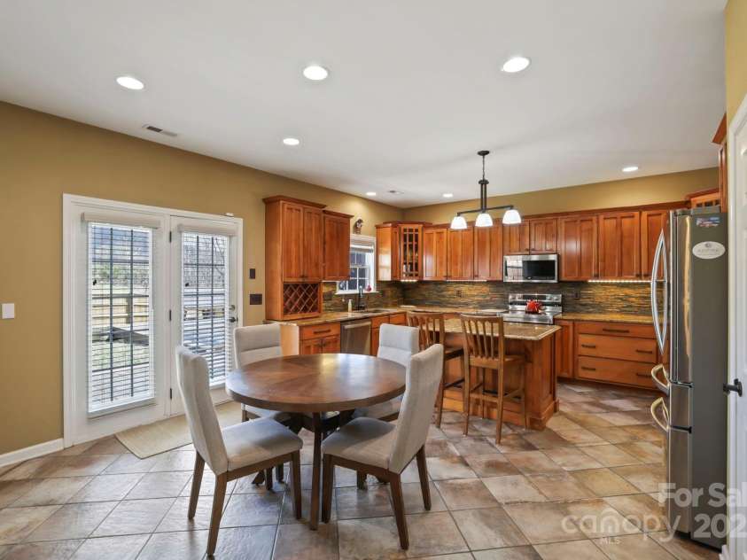 243 Wildbriar Road, Fletcher, NC 28732.  MLS# CAR4240300, YatesRealty ID 20721. Breakfast nook between kitchen and living room