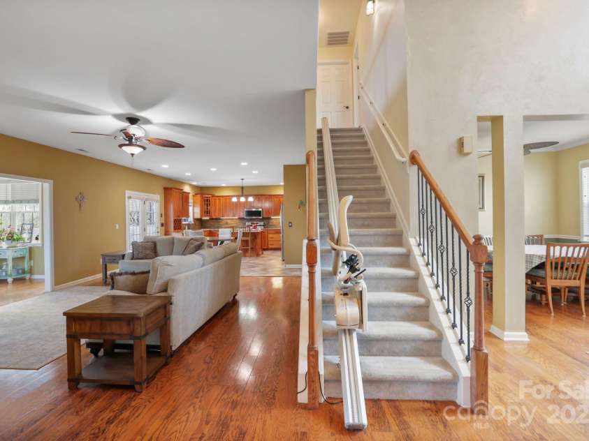 243 Wildbriar Road, Fletcher, NC 28732.  MLS# CAR4240300, YatesRealty ID 20721. Chairlift on stairs for easy access to upstairs bedrooms, family room, and laundry room.