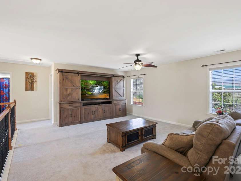 243 Wildbriar Road, Fletcher, NC 28732.  MLS# CAR4240300, YatesRealty ID 20721. Family room as you enter upper level